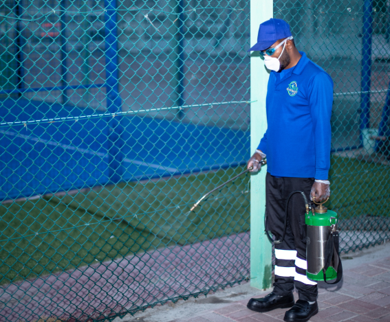 Staff member with cleaning cart