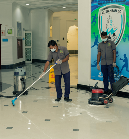 Cleaning staff mopping floor